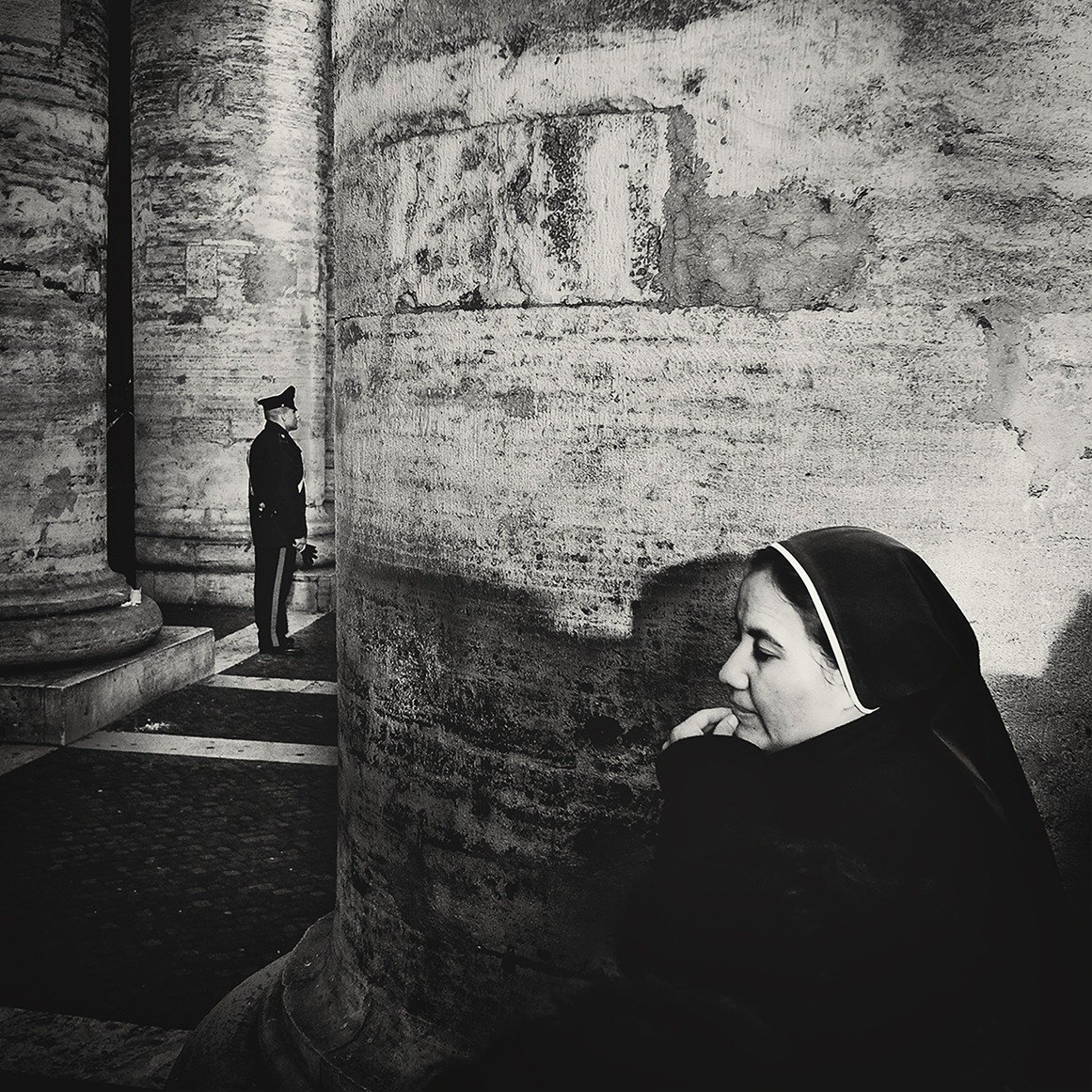 Nun at stone columns
